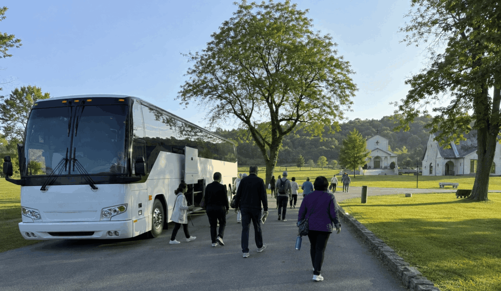 church group stepping off a charter bus for a pilgrimage day trip at an upstate new york shrine
