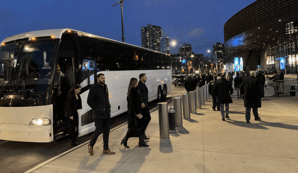 charter bus dropping off a group near barclays center on dean street before an event