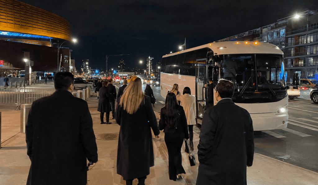 group boarding a charter bus after a barclays center event in downtown brooklyn