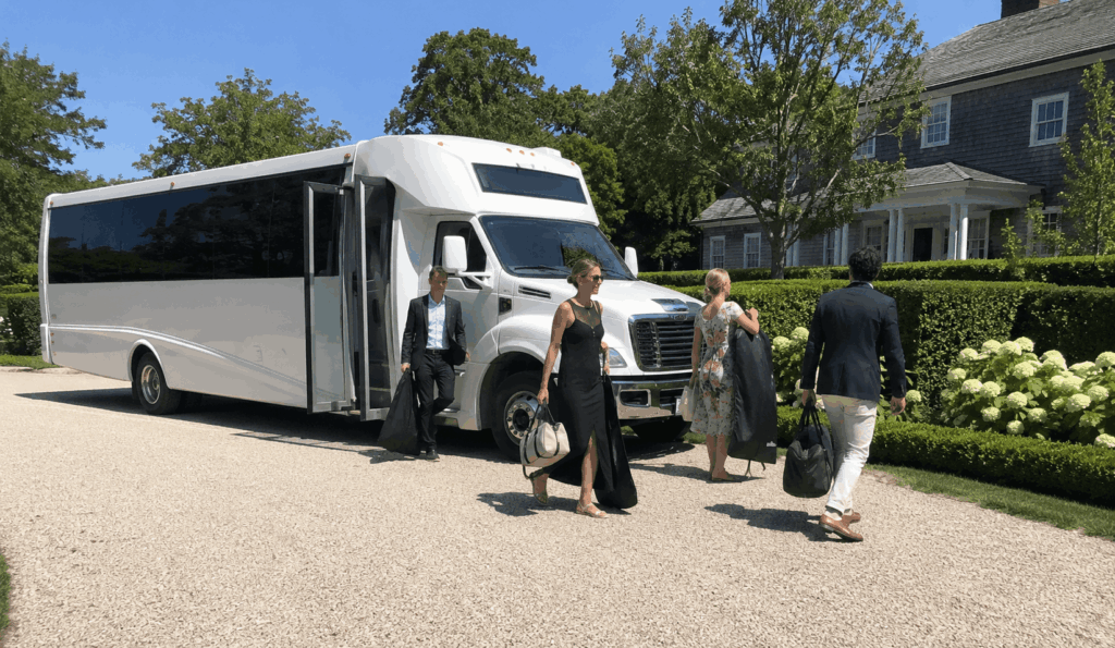 charter bus arriving with wedding guests at a hamptons venue driveway in bridgehampton