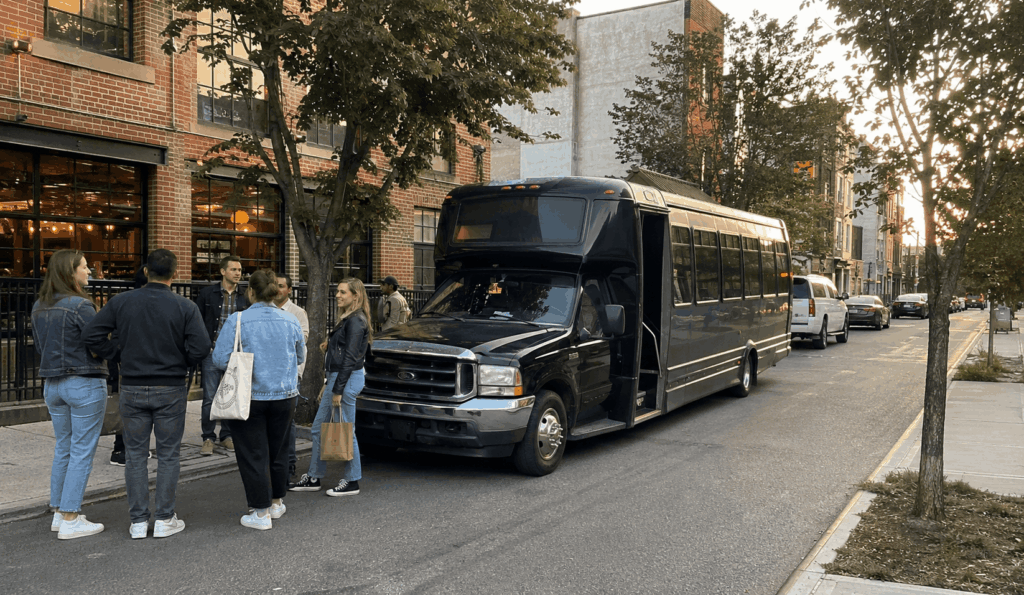 party bus waiting near a brooklyn brewery district while friends gather for a birthday brewery loop