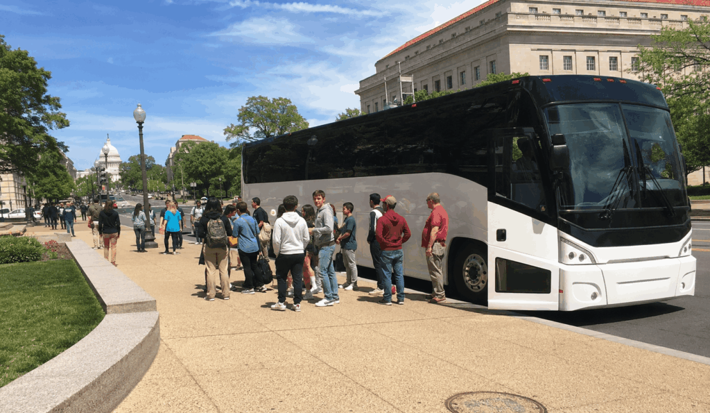charter bus arriving near the national mall in washington dc for a group trip from new york city