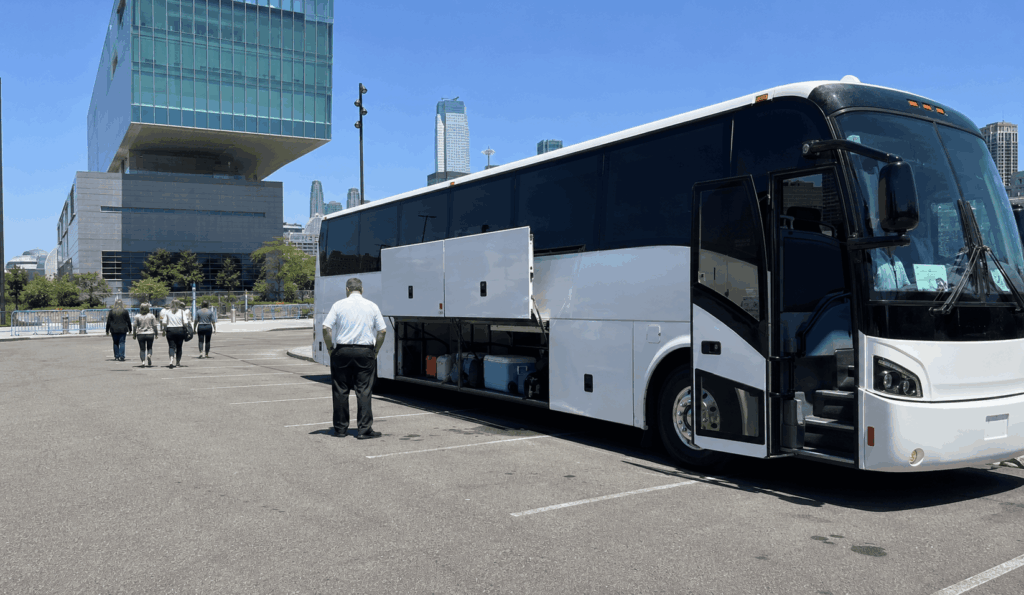 charter bus parked in the liberty science center bus lot while a school group visits the museum in jersey city
