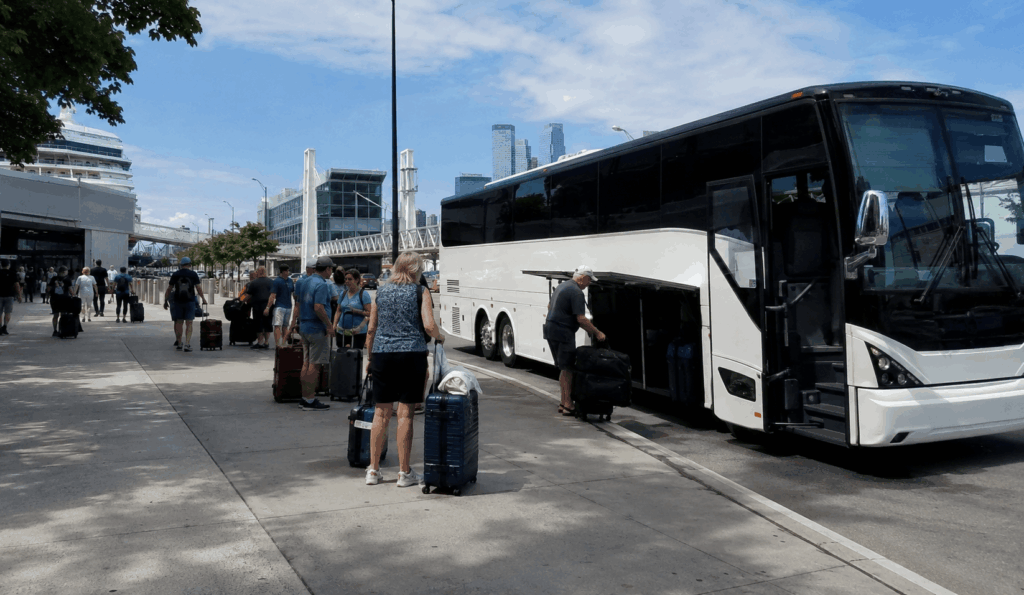 charter bus dropping off cruise passengers with luggage at the manhattan cruise terminal in new york city