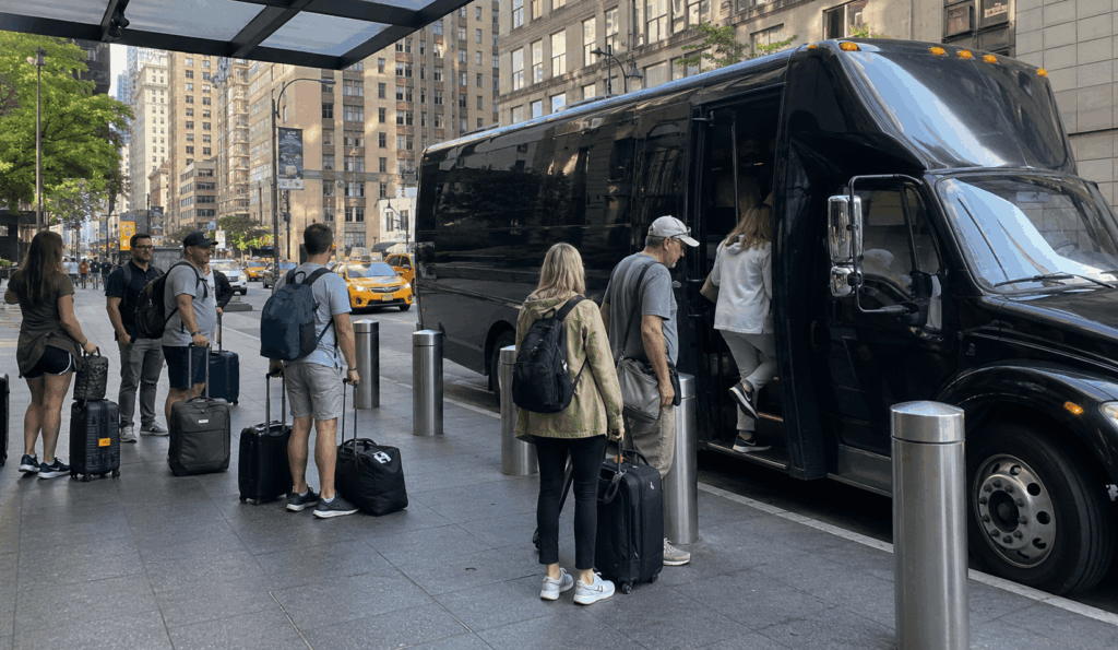 cruise group boarding a charter bus outside a midtown manhattan hotel before departing for cape liberty