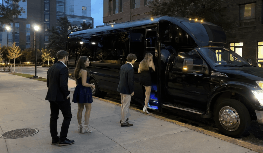 university students loading luggage onto a charter bus for an airport transfer in new york city