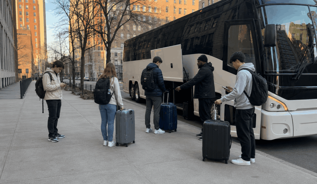 college students boarding a party bus or charter bus for a university semi-formal night in new york city