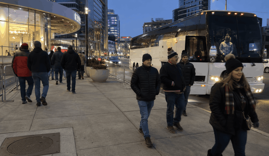 charter bus dropping off devils fans near prudential center in downtown newark