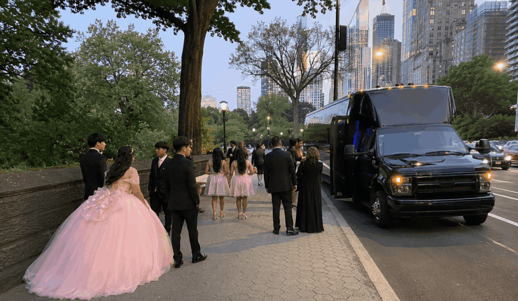 party bus dropping off a sweet 16 or quinceañera group at a banquet hall entrance in the nyc metro area