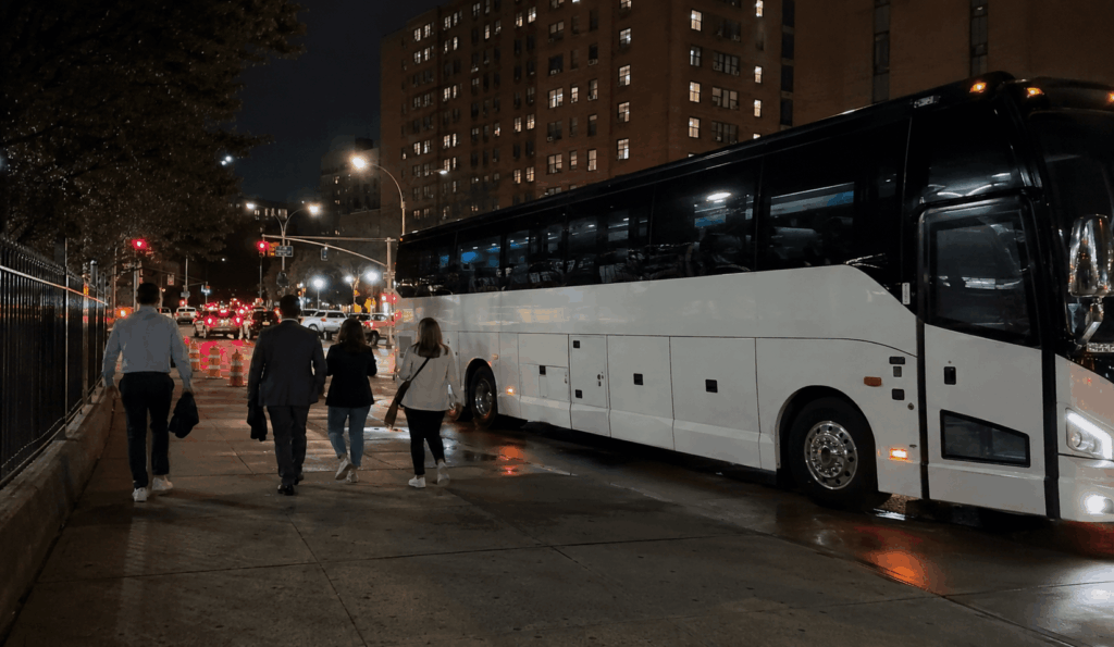 fans returning to a charter bus after a yankees game near yankee stadium in the bronx